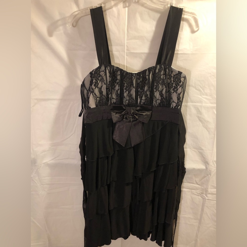 Black dress, White top with Black lace overlay satin Black straps and accent bow